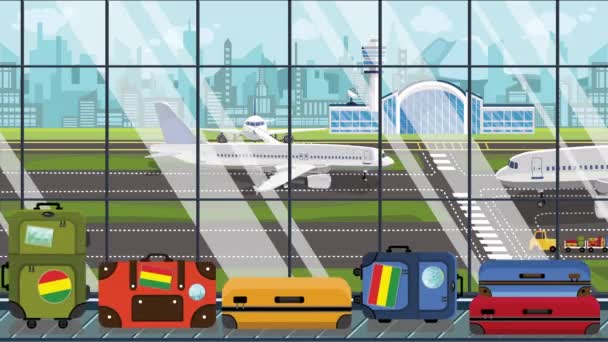 Bagage met Boliviaanse vlag stickers op carrousel in de luchthaven. Toerisme in Bolivia conceptuele loop bare cartoon animatie — Stockvideo