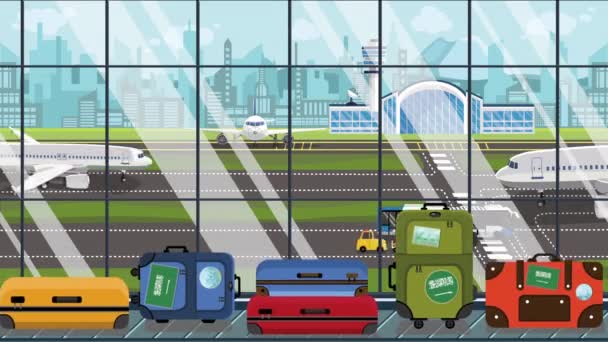 Valigie con adesivi bandiera Arabia Saudita sul carosello bagagli in aeroporto. Animazione dei cartoni animati correlati al turismo — Video Stock