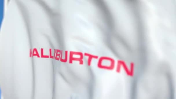 Bandeira acenando com logotipo Halliburton, close-up. Editorial loopable animação 3D — Vídeo de Stock