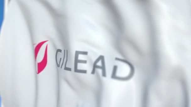 Bandiera sventolante con logo Gilead Sciences, primo piano. Animazione 3D loop editoriale — Video Stock