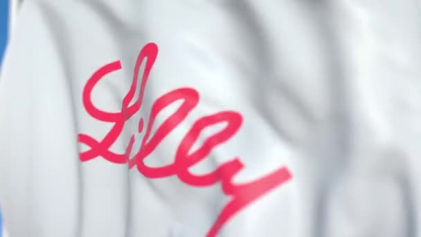 Flying flag with Eli Lilly And Company logo, close-up. Animación en 3D loopable editorial — Vídeos de Stock