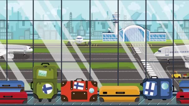 Resväskor med finsk flagg klistermärken på bagage karusellen på flygplatsen. Turismen i Finland konceptuella loopable tecknad animation — Stockvideo