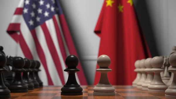 Прапори США і Китаю за Шаховою Радою. Перша пішака рухається на початку гри. Політична суперництво концептуального 3D рендеринга — стокове фото