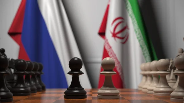 Oroszország és Irán zászlói a sakktábla mögött. Az első gyalog mozog a játék kezdetén. Politikai rivalizálás fogalmi 3D renderelés — Stock Fotó
