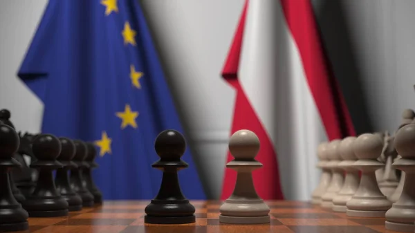 Drapeaux de l'UE et de l'Autriche derrière l'échiquier. Le premier pion se déplace au début du jeu. Rivalité politique rendu 3D conceptuel — Photo