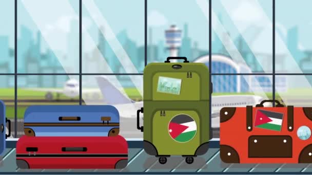 空港のカルーセルにヨルダン国旗のステッカーが貼った手荷物、クローズアップ。ヨルダン関連のループ可能な漫画のアニメーションへの旅行 — ストック動画
