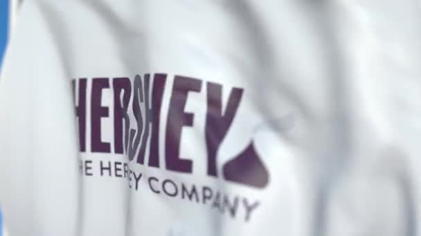 Viftande flagga med Hershey Company logo, närbild. Redaktionell loopable 3D-animering — Stockvideo