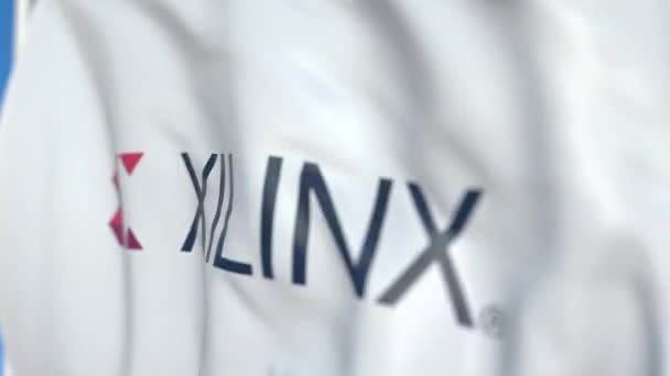 Viftande flagga med Xilinx logotyp, närbild. Redaktionell loopable 3D-animering — Stockvideo