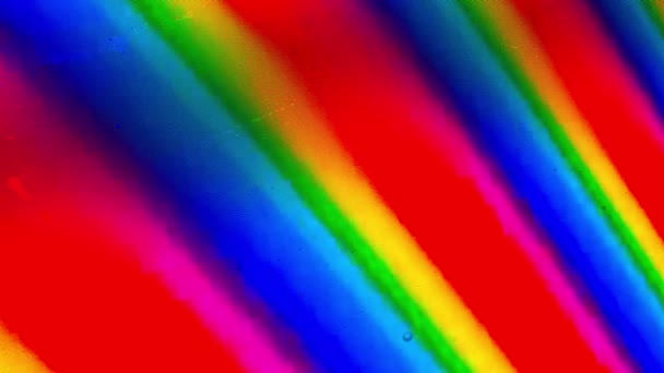 Vattendroppar täcka Rainbow LCD-skärm, Macro shot — Stockvideo