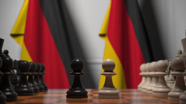 Deutschland-Fahnen hinter Schachbrett. Der erste Bauer zieht zu Beginn der Partie. politische Rivalität konzeptionelle 3D-Darstellung — Stockfoto