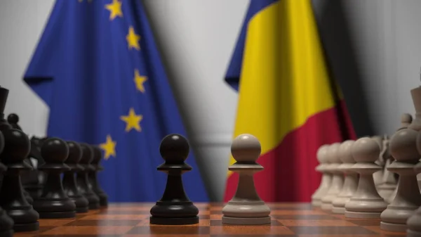 Drapeaux de l'UE et de la Roumanie derrière l'échiquier. Le premier pion se déplace au début du jeu. Rivalité politique rendu 3D conceptuel — Photo