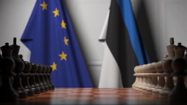 Флаги ЕС и Эстонии за шахматной доской. Первая пешка движется в начале игры. Концептуальная 3D анимация — стоковое видео