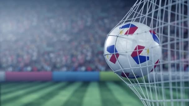 Bandera de Filipinas en la pelota en la red de fútbol. Animación 3D conceptual — Vídeo de stock