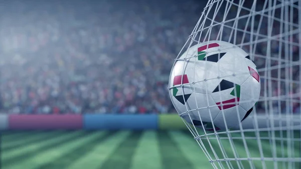 Drapeau du Soudan sur le ballon dans le filet de football. rendu 3D conceptuel — Photo
