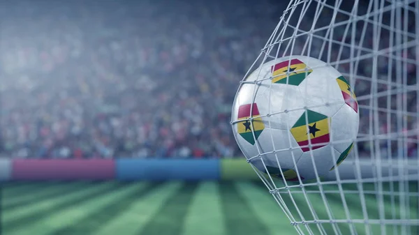 Flag of Ghana on the football hitting goal net back. Realistic 3D rendering — Stock Photo, Image