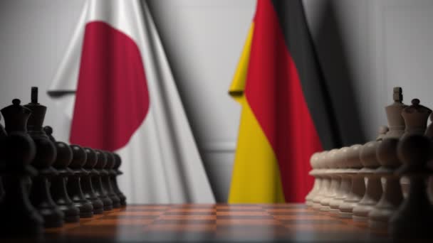 체스 보드 뒤에 일본과 독일의 국기. 첫 번째 폰은 게임 초반에 움직입니다. 정치적 경쟁 개념 3D 애니메이션 — 비디오
