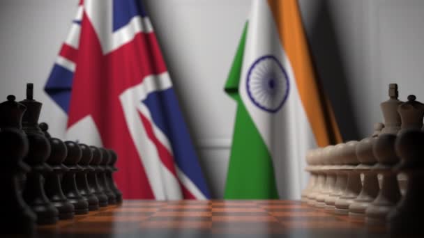 Chess game against flags of Great Britain and India. Political competition related 3D animation — Stock Video