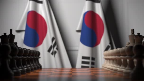Jogo de xadrez contra bandeiras da Coreia do Sul. Animação 3D relacionada à competição política — Vídeo de Stock