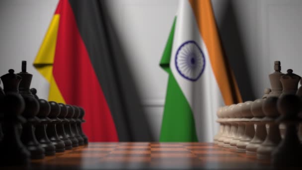 Schaakspel tegen vlaggen van Duitsland en India. Politieke competitie gerelateerde 3D-animatie — Stockvideo