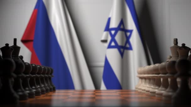 Bandeiras da Rússia e Israel atrás de peões no tabuleiro de xadrez. Jogo de xadrez ou rivalidade política relacionada com animação 3D — Vídeo de Stock