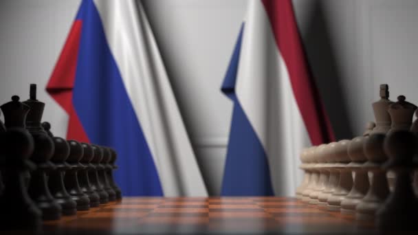 Chess game against flags of Russia and Netherlands. Political competition related 3D animation — Stock Video