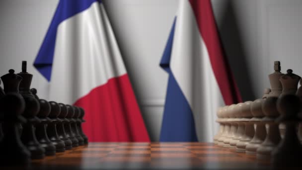 Juego de ajedrez contra banderas de Francia y Holanda. Competencia política relacionada con la animación 3D — Vídeo de stock