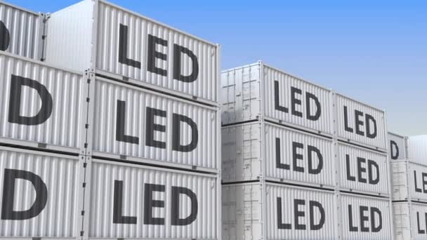 Containerterminal full av containrar med LED-text. Produktion, export eller import relaterade loopable 3D animation — Stockvideo