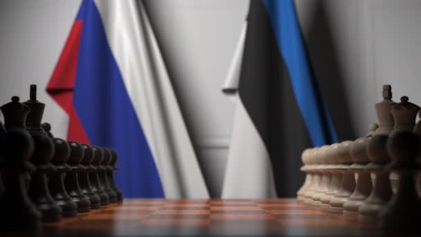 Flags of Russia and Estonia behind pawns on the chessboard. Chess game or political rivalry related 3D animation — Stock Video