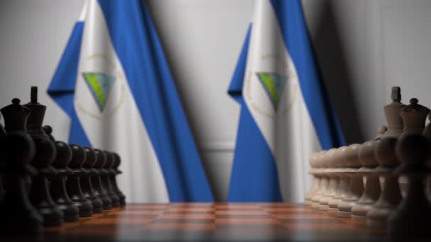 Banderas de Nicaragua detrás de peones en el tablero de ajedrez. Juego de ajedrez o rivalidad política relacionada con la animación 3D — Vídeo de stock