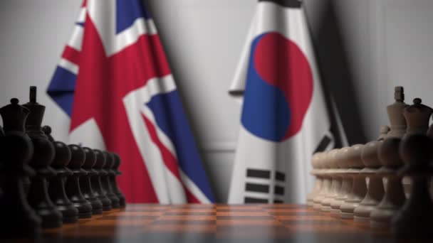 Jeu d'échecs contre les drapeaux de la Grande-Bretagne et de la Corée du Sud. Animation 3D liée à la compétition politique — Video