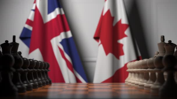 Juego de ajedrez contra banderas de Gran Bretaña y Canadá. Competencia política relacionada con la animación 3D — Vídeo de stock