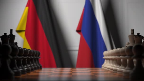 Chess game against flags of Germany and Russia — Stock Video