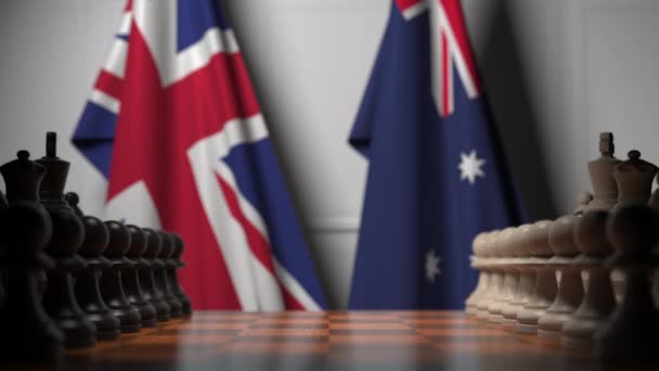 Schaakspel tegen vlaggen van Groot-Brittannië en Australië. Politieke competitie gerelateerde 3D-animatie — Stockvideo