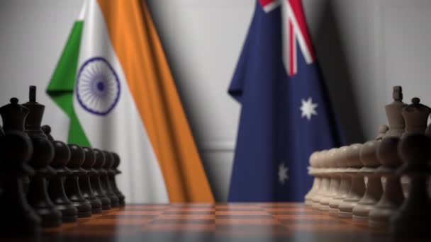 Шахматная игра против флагов Индии и Австралии. Политическая конкуренция — стоковое видео