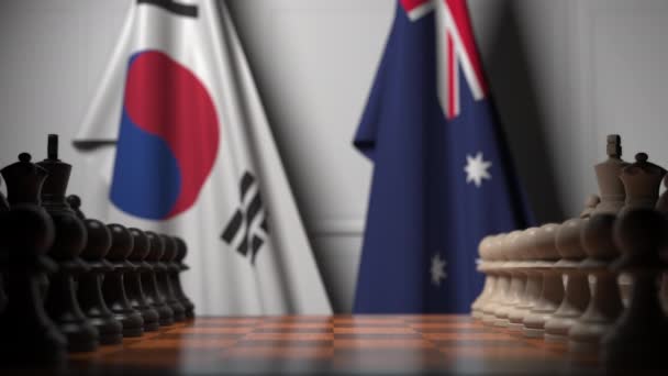 Chess game against flags of South Korea and Australia. Political competition related 3D animation — Stock Video