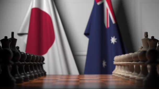 Chess game against flags of Japan and Australia. Political competition related 3D animation — Stock Video