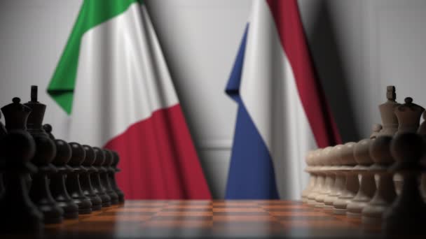 Chess game against flags of Italy and Netherlands. Political competition related 3D animation — Stock Video