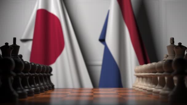 Juego de ajedrez contra banderas de Japón y Holanda. Competencia política relacionada con la animación 3D — Vídeos de Stock