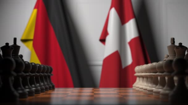 Jeu d'échecs contre les drapeaux de l'Allemagne et de la Suisse. Animation 3D liée à la compétition politique — Video