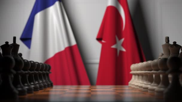 Chess game against flags of France and Turkey. Political competition related 3D animation — Stock Video