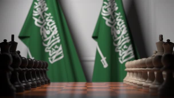 Schachspiel gegen Flaggen Saudi-Arabiens. politische Konkurrenz im Zusammenhang mit 3D-Animation — Stockvideo