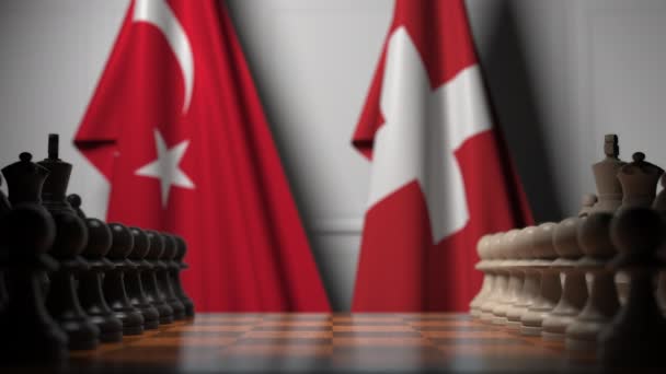 Šachová hra proti vlajkám Turecka a Švýcarska. Politická soutěž související s 3D animací — Stock video