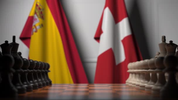 Juego de ajedrez contra banderas de España y Suiza. Competencia política relacionada con la animación 3D — Vídeos de Stock