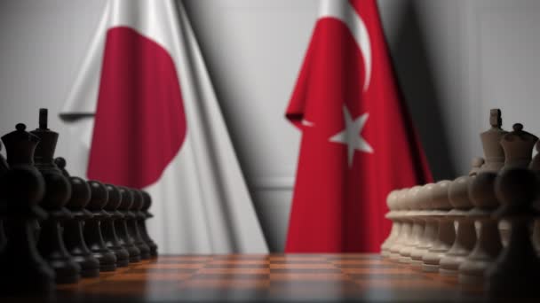 Chess game against flags of Japan and Turkey. Political competition related 3D animation — Stock Video