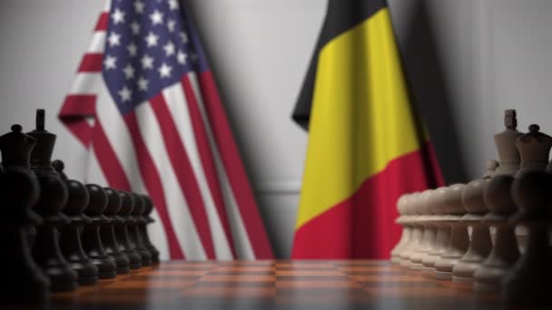 Флаги США и Бельгии за пешками на шахматной доске. Шахматная игра или политическое соперничество — стоковое видео