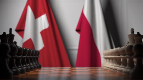 チェスボードのポーンの後ろにスイスとポーランドの旗。チェスゲームや政治的ライバル関連の3Dアニメーション — ストック動画