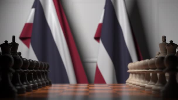 Banderas de Tailandia detrás de peones en el tablero de ajedrez. Juego de ajedrez o rivalidad política relacionada con la animación 3D — Vídeos de Stock