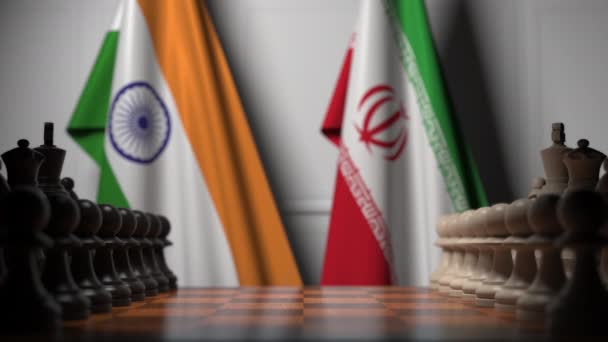 Banderas de India e Irán detrás de peones en el tablero de ajedrez. Juego de ajedrez o rivalidad política relacionada con la animación 3D — Vídeo de stock