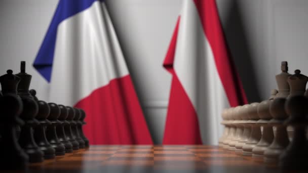 Satranç tahtasındaki piyonların arkasında Fransa ve Avusturya bayrakları. Satranç oyunu veya siyasi rekabet ile ilgili 3d animasyon — Stok video