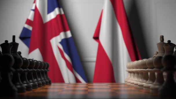 Drapeaux du Royaume-Uni et de l'Autriche derrière des pions sur l'échiquier. Jeu d'échecs ou rivalité politique liée à l'animation 3D — Video